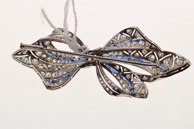 Lot 45 - Diamond and calibré sapphire bow brooch