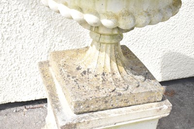 Lot 218 - Pair of composition stone garden pedestal urns