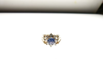 Lot 11 - 9ct gold. blue and white stone cluster ring