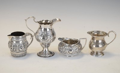 Lot 105 - Three silver cream jugs and Middle Eastern example