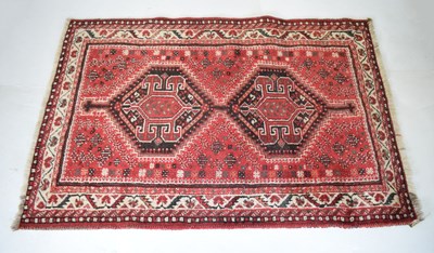 Lot 503 - Small red ground Persian rug