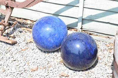 Lot 647 - Pair of glazed blue ceramic garden globes