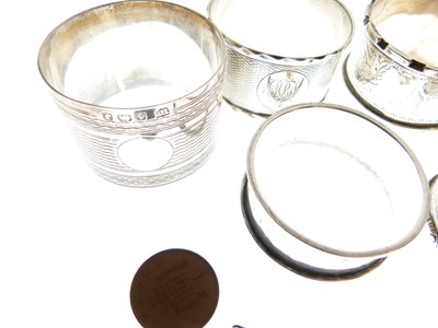 Lot 91 - Set of three late Victorian silver napkin rings, plus four singles