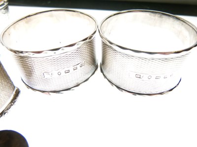 Lot 91 - Set of three late Victorian silver napkin rings, plus four singles