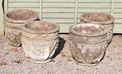 Lot 645 - Set of four composite stone garden planters