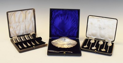 Lot 127 - Edwardian cased silver shell butter dish and two other cased sets