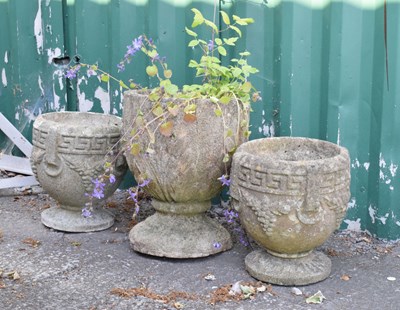 Lot 637 - Three composite stone circular garden urns or pots