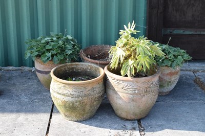 Lot 644 - Pair of terracotta garden pots together with a set of three garden planters