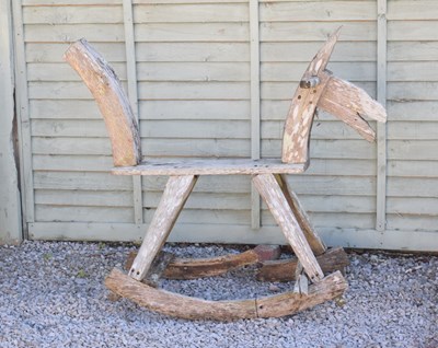 Lot 791 - Child's 20th century teak rocking horse