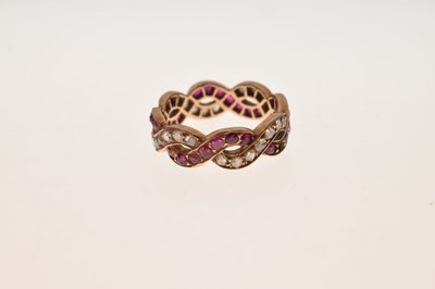 Lot 13 - Ruby and diamond crossover full eternity ring