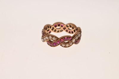 Lot 13 - Ruby and diamond crossover full eternity ring