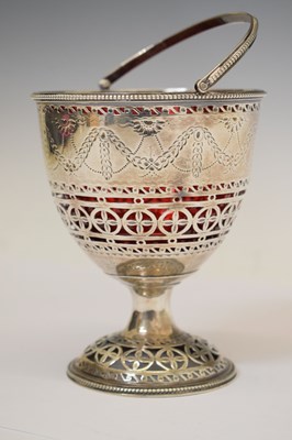 Lot 70 - George III silver pedestal sugar basket with swing handle