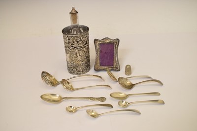 Lot 170 - Edward VII silver-wrapped perfume bottle, photo frame, thimble, assorted sifting spoons, etc