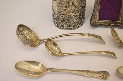 Lot 170 - Edward VII silver-wrapped perfume bottle, photo frame, thimble, assorted sifting spoons, etc