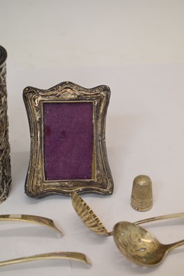 Lot 170 - Edward VII silver-wrapped perfume bottle, photo frame, thimble, assorted sifting spoons, etc