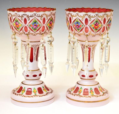 Lot 310 - Pair of cranberry and overlaid candle lustres