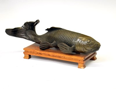 Lot 471 - Japanese bronze model of a Koi carp on wooden stand