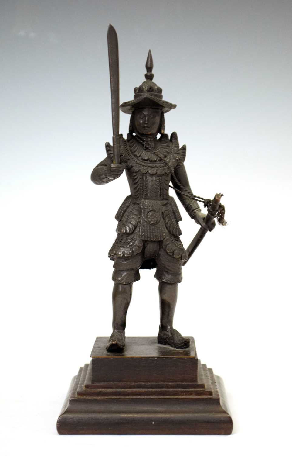 Lot 462 - South East Asian bronze figure of an armoured warrior