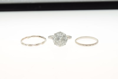 Lot 34 - Single stone ring set large white faceted stone, the white metal shank stamped '18ct'