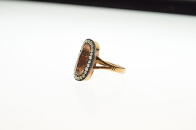 Lot 38 - '9ct' stamped yellow metal, seed pearl and brown stone ring