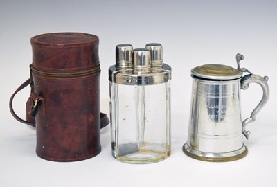 Lot 192 - Cased three-bottle set and tankard