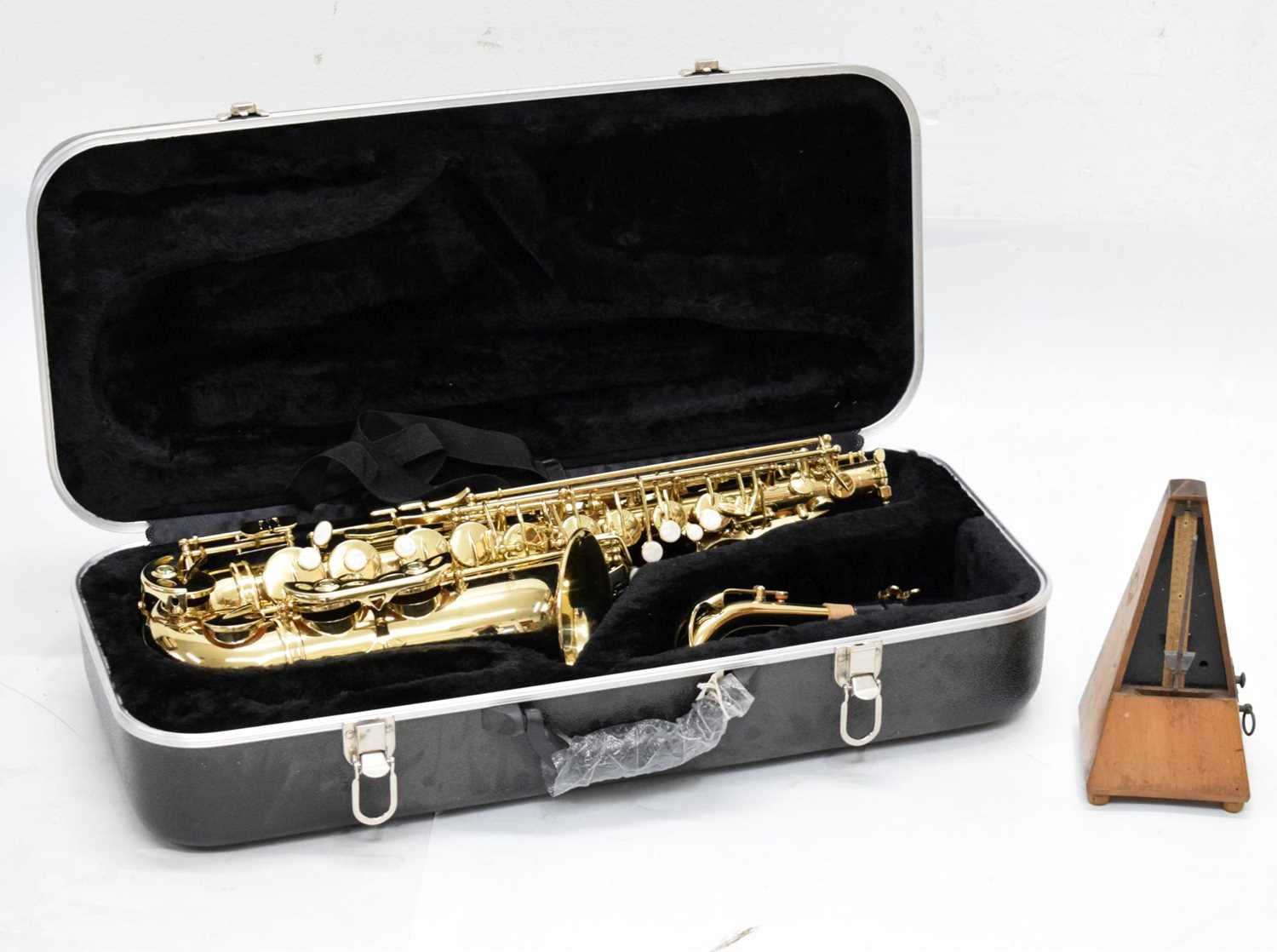 Lot 227 Conrad saxophone plus metronome