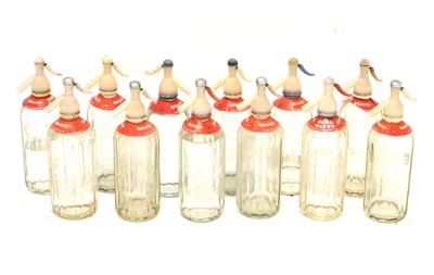 Lot 629 - Twelve Adcock's soda water syphons