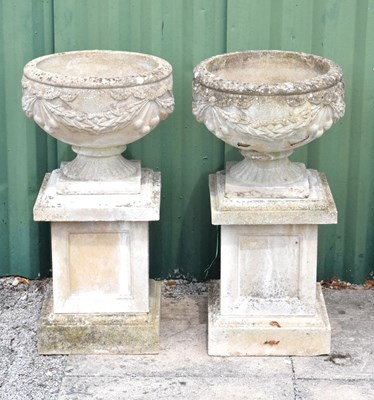 Lot 635 - Pair of composition garden urns and pedestals