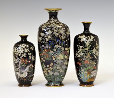 Lot 494 - Three Japanese Meiji period dark blue cloisonné vases