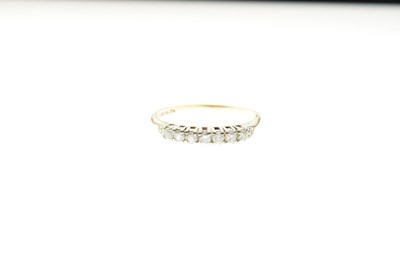 Lot 10 - Seven stone diamond half eternity ring