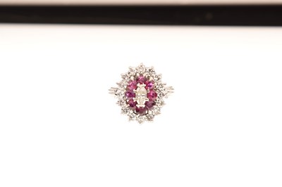 Lot 28 - 18ct white gold, ruby and vari-cut diamond cluster ring
