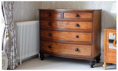 Lot 585 - 19th Century mahogany bowfront chest of four long drawers