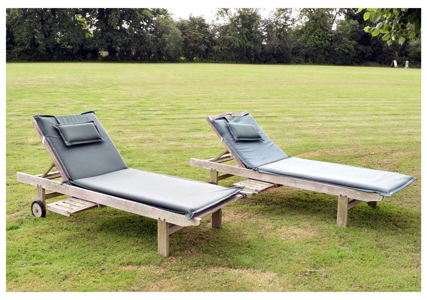 Lot 560 - Pair of teak garden sun loungers