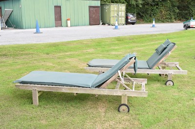 Lot 560 - Pair of teak garden sun loungers