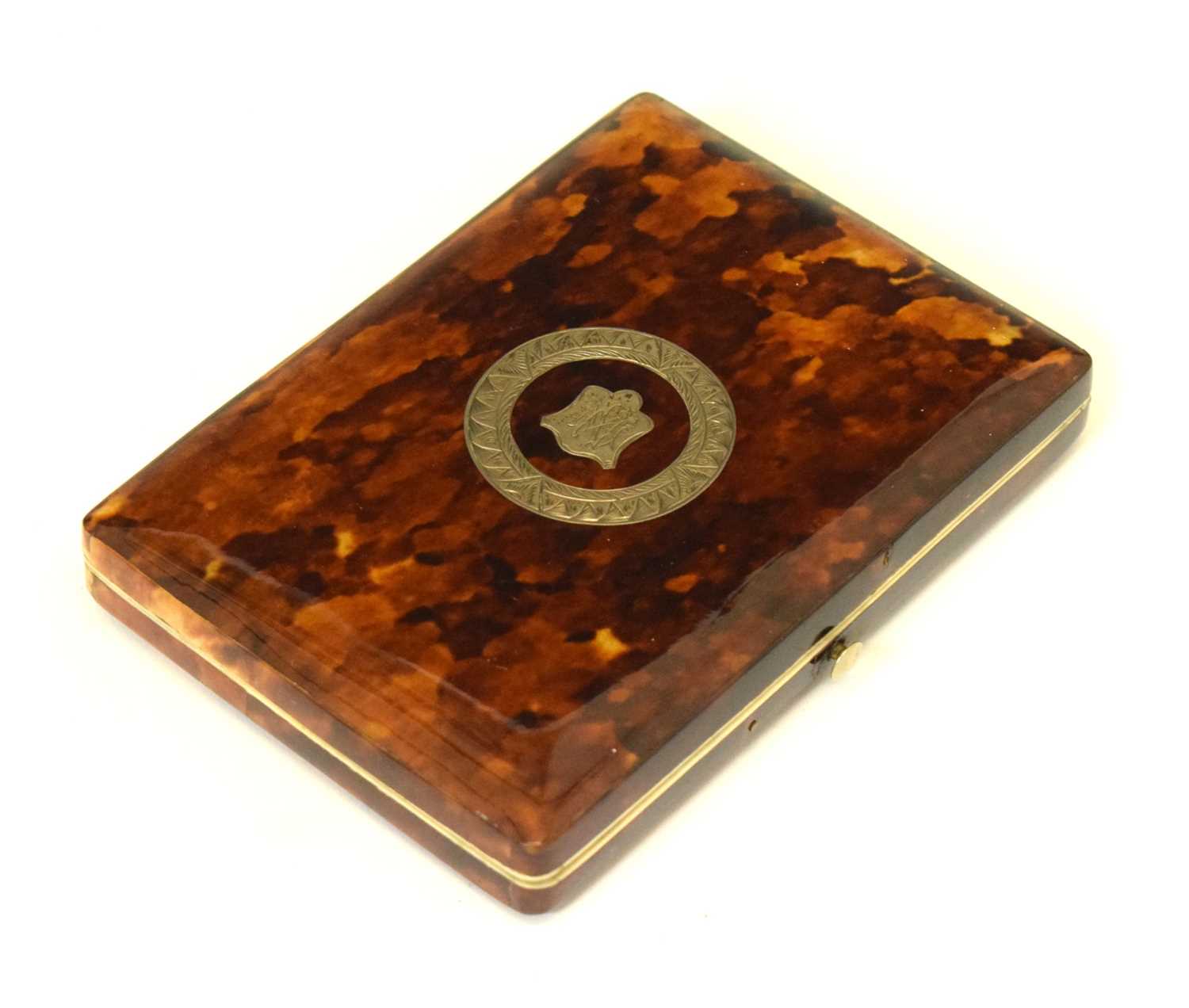 Lot 232 - Tortoiseshell shell purse with silver inlay crest