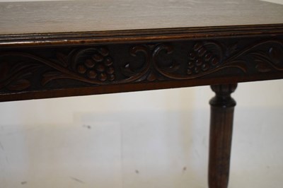 Lot 490 - Dark oak side table with vine frieze
