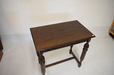 Lot 490 - Dark oak side table with vine frieze