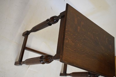 Lot 490 - Dark oak side table with vine frieze