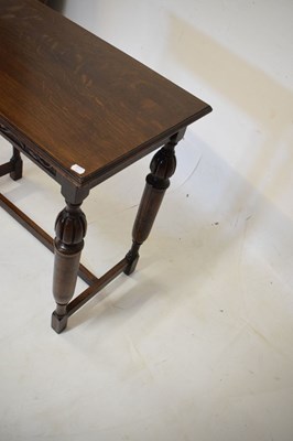 Lot 490 - Dark oak side table with vine frieze