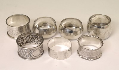 Lot 128 - Pair of George VI silver napkin rings together with five other silver napkin rings