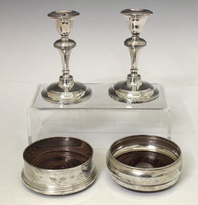 Lot 139 - Pair of George V  dwarf silver candlesticks together with two Elizabeth II wine coasters