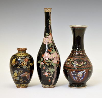 Lot 483 - Three Japanese black ground cloisonné vases