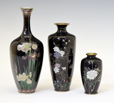 Lot 487 - Three Japanese dark blue ground cloisonné  vases