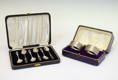 Lot 121 - Cased set of six George VI silver coffee spoons and cased pair of napkin rings