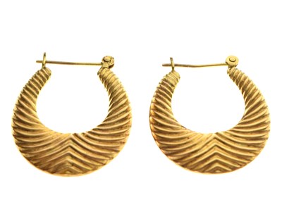 Lot 84 - Pair of unmarked yellow metal hoop earrings