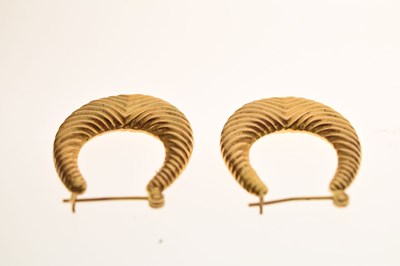 Lot 84 - Pair of unmarked yellow metal hoop earrings