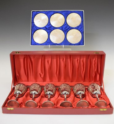 Lot 123 - Cased set of six Elizabeth II silver goblets and cased set of six silver coasters
