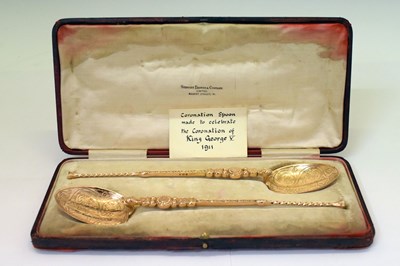 Lot 143 - Cased pair of George V silver-gilt anointing spoons
