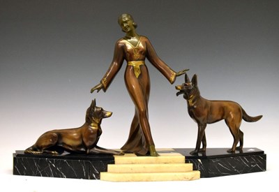 Lot 399 - Deco style group - lady with Alsatians