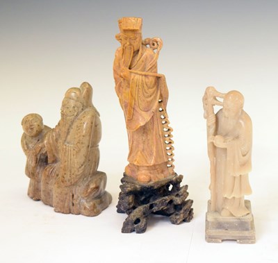 Lot 513 - Three carved soapstone figures